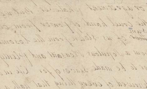 faint cursive writing on aged, yellowed paper